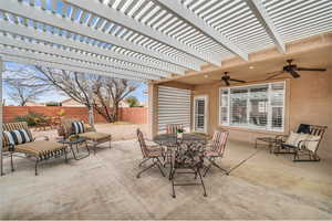 View of patio / terrace featuring ceiling fan and a pergola