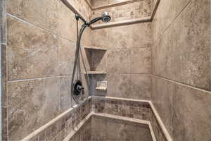 Interior details with a tile shower