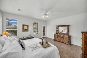 Bedroom with ceiling fan and access to exterior