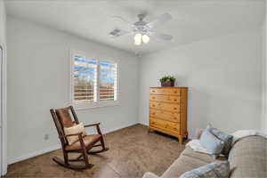 Sitting room featuring ceiling fan