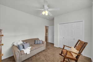 Living area featuring ceiling fan