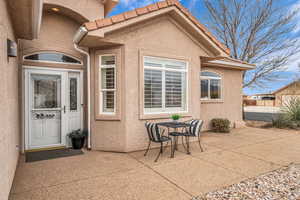 Doorway to property with a patio