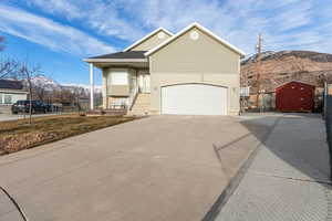 View of front of house featuring a garage and a mountain view