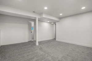 Basement with carpet flooring