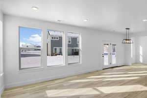 Unfurnished room featuring light wood-type flooring