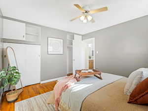 Bedroom featuring hardwood / wood-style floors and ceiling fan