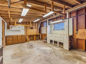 Garage workshop area with wood-burning fireplace!