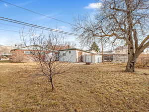 View of yard with a storage shed