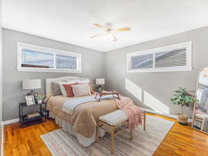 Bedroom with ceiling fan and light wood-type flooring