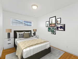 Virtually Staged Bedroom featuring hardwood / wood-style floors