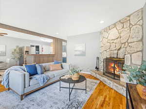 Living room with wood-type flooring and a fireplace