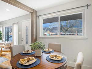 Dining space with hardwood / wood-style flooring