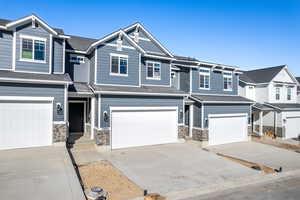 View of front facade featuring a garage