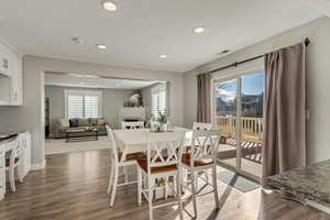 Dining area featuring dark hardwood / wood-style flooring and a wealth of natural light