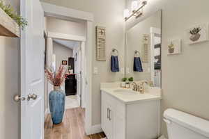 Bathroom featuring vanity and toilet