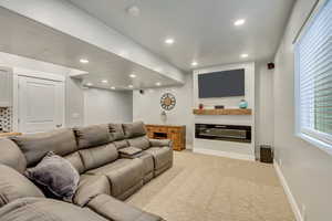 Cinema room with light colored carpet