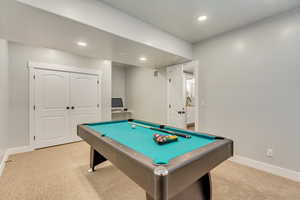 Rec room with light carpet and pool table