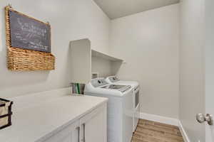 Laundry room with washing machine and dryer