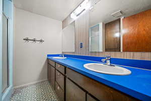 Bathroom with vanity and walk in shower