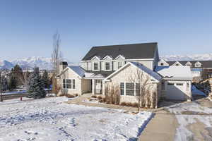 Front facade featuring a garage and a mountain view