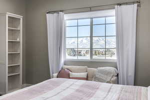 Bedroom featuring a mountain view