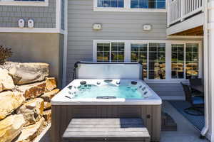 View of patio / terrace featuring a covered hot tub