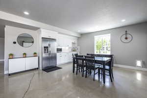 Dining area with a textured ceiling