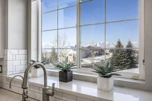 Details with light stone counters and a mountain view