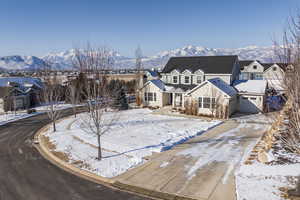 View of front of property featuring a garage and a mountain view