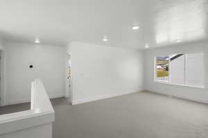 Unfurnished room featuring carpet flooring