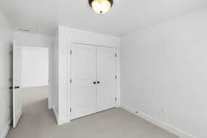 Unfurnished bedroom with a closet