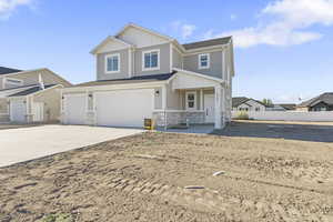 View of front facade featuring a garage