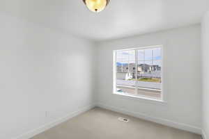 View of carpeted spare room