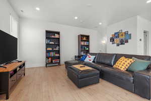 Living room with light wood-type flooring