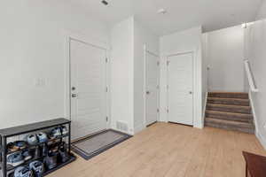 Foyer featuring light laminate flooring