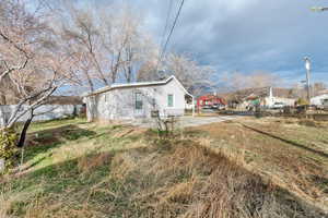 View of side of home and  garden area