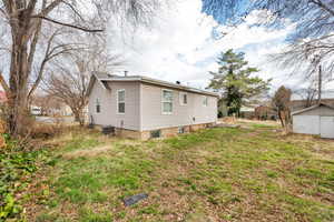 View of backyard and  property exterior with cooling unit