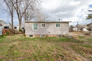 Backyard of house with a lawn