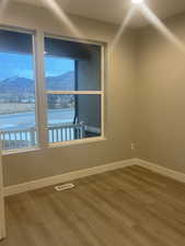 Office/Study with hardwood / wood-style flooring and a mountain view