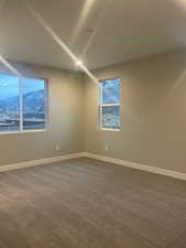 Owners Bedroom with a mountain view and carpet floors