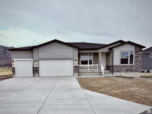 Ranch-style house with a porch and a 3-car garage