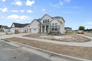 View of front of property featuring a garage