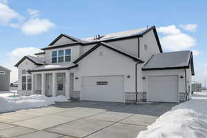 View of front of property featuring a garage