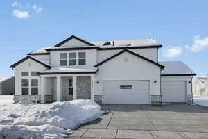 View of front of property featuring a garage