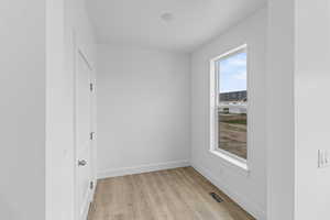 Empty room featuring light hardwood / wood-style flooring