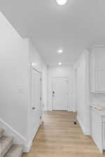 Hall featuring light hardwood / wood-style flooring