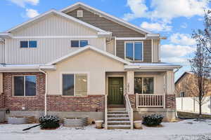 Craftsman inspired home featuring covered porch