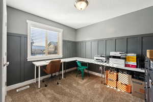 Office area with dark colored carpet