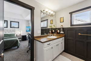 Bathroom featuring tile patterned floors and vanity