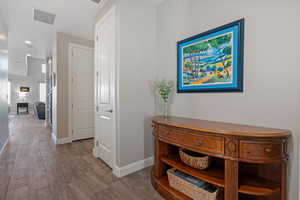 Hallway featuring light hardwood / wood-style flooring